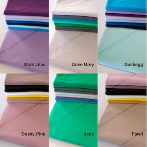 May include: A collection of ten fabric swatches in various colors, including dark lilac, dove grey, duck egg, dusky pink, jade, and fawn. The swatches are stacked on top of each other and are all the same size.