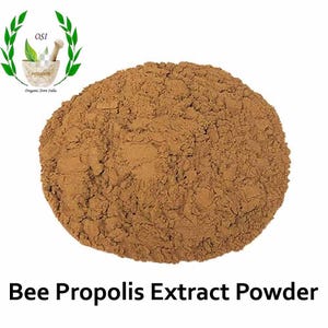 May include: A close-up of a pile of brown bee propolis extract powder. The powder is a natural product and is often used in supplements and natural remedies.