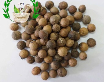 以下が含まれることがあります： 茶色の白檀の種子の山をクローズアップした画像。種子は丸く、わずかにざらざらした質感があります。種子の山の下に「WHITE SANDALWOOD SEEDS」という文字が印刷されています。