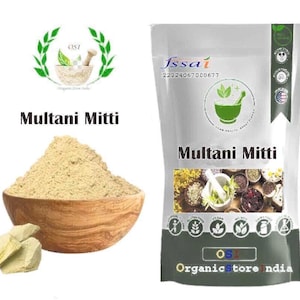 May include: A bag of Multani Mitti powder with a wooden bowl and a few pieces of the clay. The bag has the text "Multani Mitti" and a logo. The words "Organic Store India" are also visible.