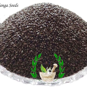 May include: A close-up image of a bowl filled with black tukhmalaanga seeds. The seeds are small and oval-shaped. The bowl is made of clear glass and has a decorative rim. The text "Tukhmalaanga Seeds" is visible at the top of the image.