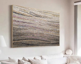 May include: A large abstract mosaic wall art with a gold frame. The mosaic is made up of small, irregular pieces of glass and tile in shades of brown, beige, and gold. The mosaic creates a wavy pattern.