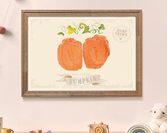 May include: A framed watercolor print of a pumpkin with the text "Our little BUMPKIN" and "HOME-GROWN WITH LOVE" in a vintage style.
