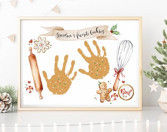May include: A white printable art print with a brown frame. The print features a handprint cookie design with the text "Grandma's favorite cookies". The design includes a gingerbread man, a rolling pin, a whisk, and a candy cane.
