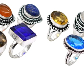 May include: Set of 10 silver rings with various colored gemstones. The rings feature intricate designs and are perfect for stacking or wearing individually.