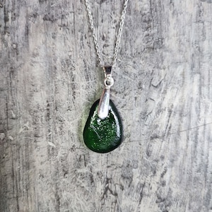 Green sea glass pendant on 22cm long silver plated chain