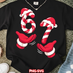 May include: Black sweatshirt featuring a festive design with the numbers "67" styled as candy canes, complete with Santa hats. Below the numbers are red gloved hands with white cuffs, suggesting a holiday theme. The text "PNG-SVG" is at the bottom.