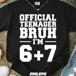 May include: Black sweatshirt with white text that reads "OFFICIAL TEENAGER BRUH I'M 6+7". The sweatshirt has a crew neck and long sleeves. A delicate silver necklace is visible at the neckline.