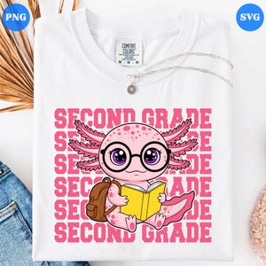 May include: A white t-shirt featuring a graphic of a pink axolotl wearing black glasses, carrying a brown backpack, and holding an open yellow book. The background of the graphic consists of the repeating pink text SECOND GRADE in a block font.