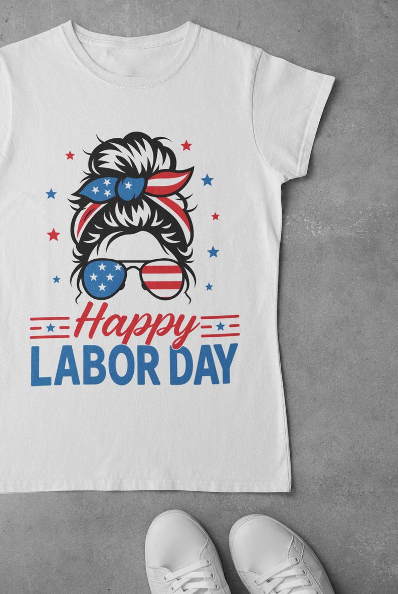 May include: White t-shirt with a graphic design for Labor Day. The design features a woman's silhouette with a red, white, and blue headband and sunglasses. The text "Happy Labor Day" is in red and blue.
