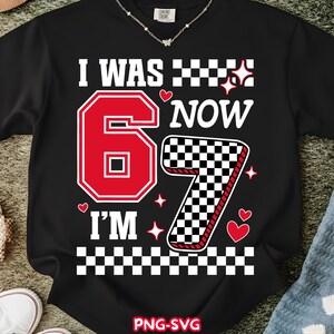 May include: Black t-shirt with the text "I WAS 6 NOW I'M 7". The number 6 is red with a white outline, and the number 7 is a black and white checkered pattern with a red outline. The shirt also has hearts and stars.