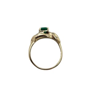 Vintage Emerald Ring in 14k Yellow Gold with Diamonds. Lucious medium Green Emerald cut Emerald makes a Statement in an Art Nouveau-esque Setting. Not too big or too small this half-carat size gemstone is a beautiful sample of Natural Emerald sure to Complement any Outfit.