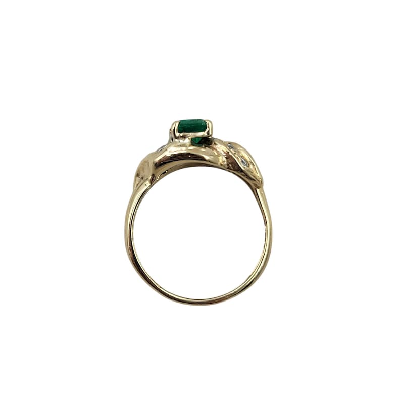Vintage Emerald Ring in 14k Yellow Gold with Diamonds. Lucious medium Green Emerald cut Emerald makes a Statement in an Art Nouveau-esque Setting. Not too big or too small this half-carat size gemstone is a beautiful sample of Natural Emerald sure to Complement any Outfit.