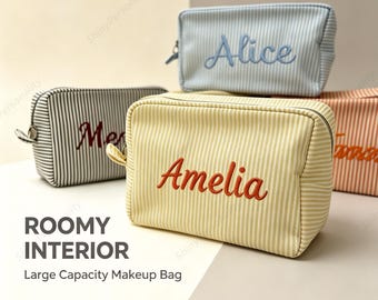 May include: A collection of rectangular zippered pouches featuring vertical stripes in various pastel colors. Each pouch is embroidered with a name in a cursive font, including Alice, Amelia, and others, designed for storing cosmetics.