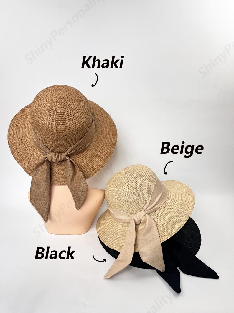 May include: Three straw sun hats with ribbon ties. The hats are in khaki, beige, and black.