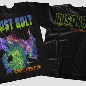 May include: Black t-shirt with a green, blue, and purple graphic of a band called "Dust Bolt" with the text "Violent Demoliton". The back of the shirt has the band name "Dust Bolt" with the text "Violent Demoliton".
