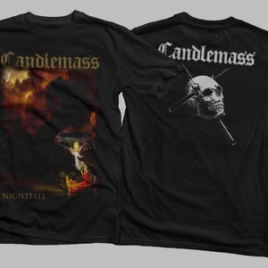 May include: Black t-shirt featuring the band name "Candlemass" in gold lettering on the front, with a fiery graphic and the word "Nightfall". The back displays the band name and a skull with crossed spears.