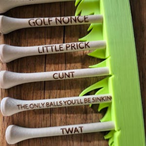 Offensive golf tees set of 10 with grassy stand