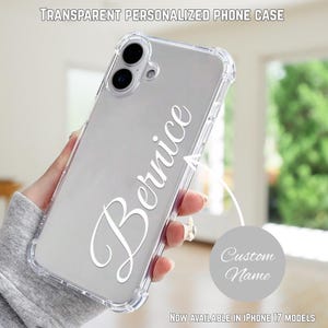 May include: A clear phone case with a custom name in a cursive font. The case is transparent with a protective bumper. The text "Bernice" is displayed on the case. The top of the image reads "TRANSPARENT PERSONALIZED PHONE CASE".