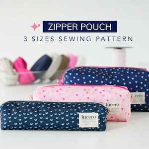 Puede incluir: Tres estuches con cremallera rectangulares en azul marino, rosa y azul marino, estampados con corazones blancos. Las bolsas están etiquetadas como "lucero". El texto "ZIPPER POUCH 3 SIZES SEWING PATTERN" se muestra arriba.