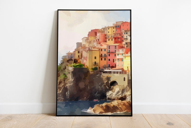 May include: A watercolor painting of a colorful village built on a cliff overlooking the ocean. The buildings are painted in shades of yellow, orange, red, and pink. The ocean is a deep blue, and the sky is a soft pink.