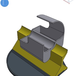 May include: A 3D model of a grey and gold phone stand with a curved top and a base. The stand is designed to hold a phone upright and has a small compartment for charging cables.