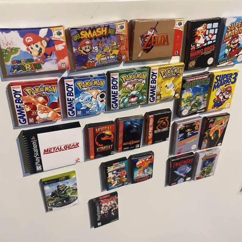 May include: A collection of vintage video game cartridges, including Super Mario, Super Smash Bros, Zelda, Pokemon, Mortal Kombat, Sonic, and Final Fantasy. The cartridges are displayed on a white surface.