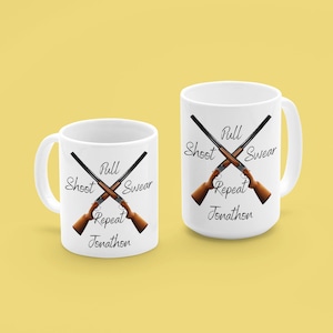May include: Two white coffee mugs featuring a design of crossed shotguns and the text "Pull Shoot Swear Repeat Jonathon".