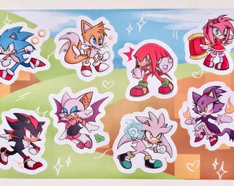 Op de afbeelding: Een set van negen kleurrijke cartoon-personage stickers met Sonic the Hedgehog-personages. De stickers bevatten Sonic, Tails, Knuckles, Amy Rose, Shadow, Rouge, Silver, Blaze en Vector. De stickers zijn gedrukt op wit glanzend papier en zijn perfect voor het versieren van laptops, waterflessen, notitieboekjes en meer.