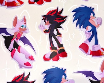 Könnte beinhalten: Ein Set mit Aufklebern, die Charaktere aus der Videospiel-Reihe Sonic the Hedgehog zeigen. Die Aufkleber sind auf weißem Papier gedruckt und zeigen eine Vielzahl von Charakteren, darunter Sonic, Shadow und Rouge. Die Aufkleber sind perfekt, um Laptops, Wasserflaschen oder anderen Oberflächen einen Hauch von Spaß zu verleihen.
