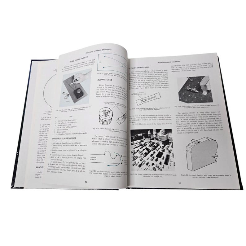 May include: An open book with black and white illustrations and text about electronics. The pages show diagrams, schematics, and images of electronic components. The book is open to pages 42 and 43.