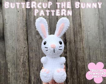 May include: White crocheted bunny amigurumi pattern, called "Buttercup the Bunny Pattern". The bunny has pink ears and black eyes. The pattern is a digital download only.