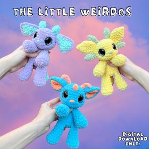 May include: Three handmade crochet plush toys in shades of purple, yellow, and blue, each with large, expressive eyes and unique ear and horn designs. The text "THE LITTLE WEIRDOS" is at the top, and "DIGITAL DOWNLOAD ONLY!" is at the bottom.