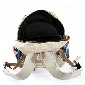 May include: A beige canvas backpack with blue and red striped fabric accents. The backpack has adjustable straps and a zippered closure.