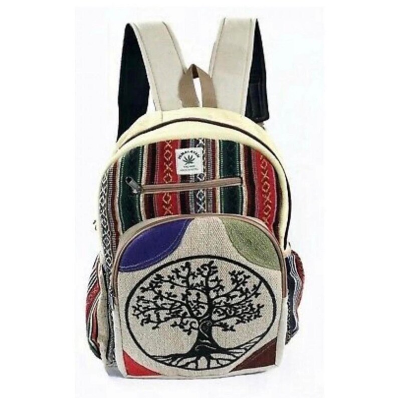 May include: A multi-colored hemp backpack with a tree of life design. The backpack has a zippered pocket on the front and adjustable straps.