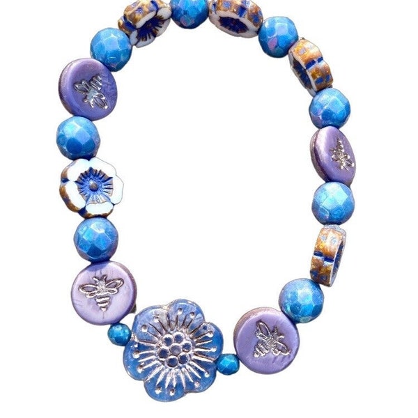 Periwinkle Czech glass wild rose bead bracelet adorned by antiqued ivory flowers with a lavender blue wash, lavender bees & periwinkle beads