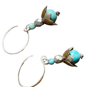 Turquoise with gold bead set in antique silver & brass bead cap flower Earrings adorned with a faceted silver matte bead.