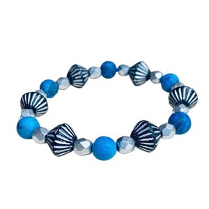Black with silver wash Czech glass bicone bead bracelet adorned with matte blue jasper & silver beads.