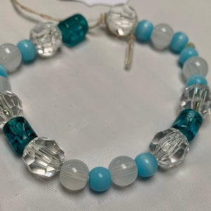 Blue and clear glass bead slip on bracelet