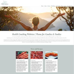 May include: A website design showcasing a woman with raised arms against a sunset. The site's theme is for health coaches and foodies, with news and recipes. The design includes images of carrots, tomatoes, and orange slices.