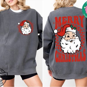 May include: A charcoal gray sweatshirt with a vintage-style illustration of Santa Claus on the front and the text "Merry Christmas" on the back.