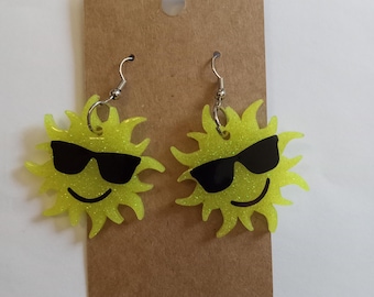 Cute glittery resin happy sun wearing shades dangling earrings