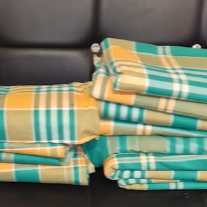 Tela 100% algodón con estampado a cuadros Madras, tejido nacional de Montserrat, para confección de ropa y decoración de eventos nacionales y culturales. imagen 1