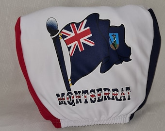Un par de reposacabezas elásticos para vehículos con los colores británicos rojo, blanco y azul, con la inscripción Montserrat.