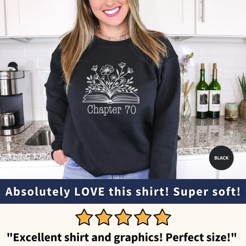 May include: Black sweatshirt with a white graphic of a book with flowers and the text "Chapter 70".