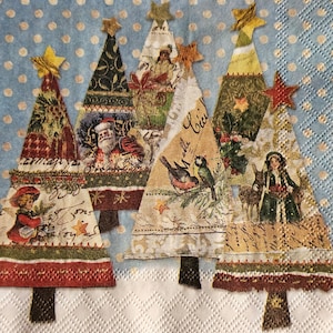 May include: Four Christmas tree-shaped paper napkins with a blue polka dot background. The trees are decorated with vintage-style images of birds, Santa Claus, and other holiday motifs.