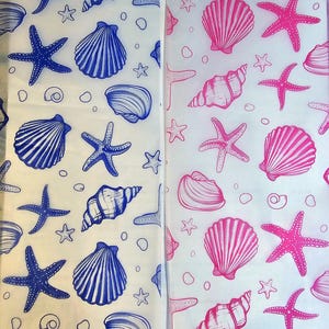 May include: Two sheets of white paper featuring a repeating pattern of seashells and starfish. One sheet has blue designs, the other pink. The illustrations include various shell shapes and starfish, with small circles scattered throughout.