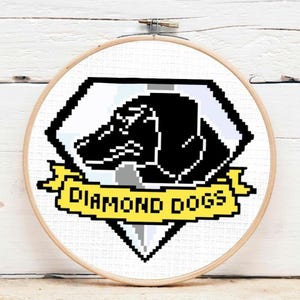 May include: A black and white pixel art design of a dog's head inside a diamond shape with the words "Diamond Dogs" on a yellow banner.
