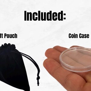 May include: Included: A black velvet gift pouch and a clear plastic coin case.