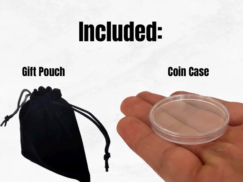 May include: Included: A black velvet gift pouch and a clear plastic coin case.